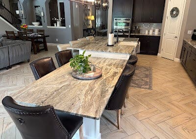 Modern kitchen with Brown Fantasy Dolomite countertops and dining area.