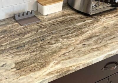 Brown Fantasy Dolomite kitchen countertop with appliances and jar