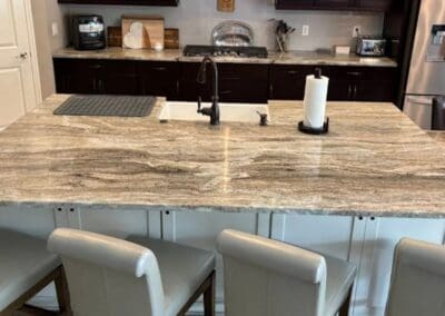 Modern kitchen with large Brown Fantasy Dolomite island