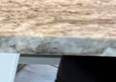 Close-up of Brown Fantasy Dolomite kitchen countertop corner.