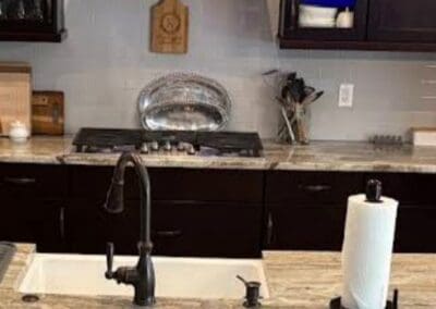 Modern kitchen with Brown Fantasy Dolomite countertops and appliances.